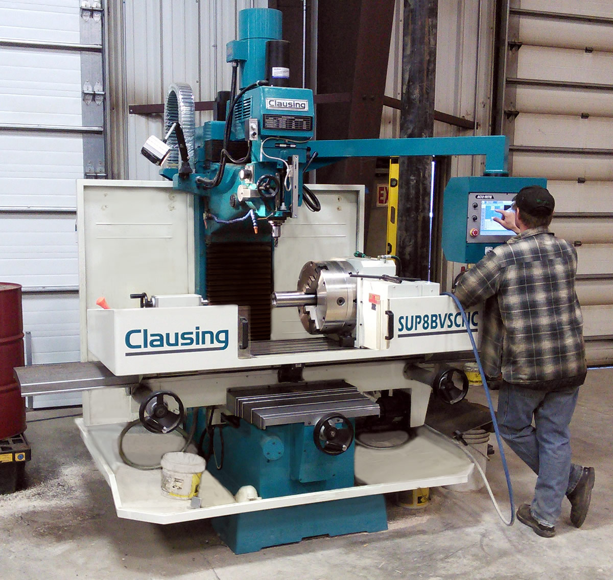 Employee using Central Trenching equipment in the shop.